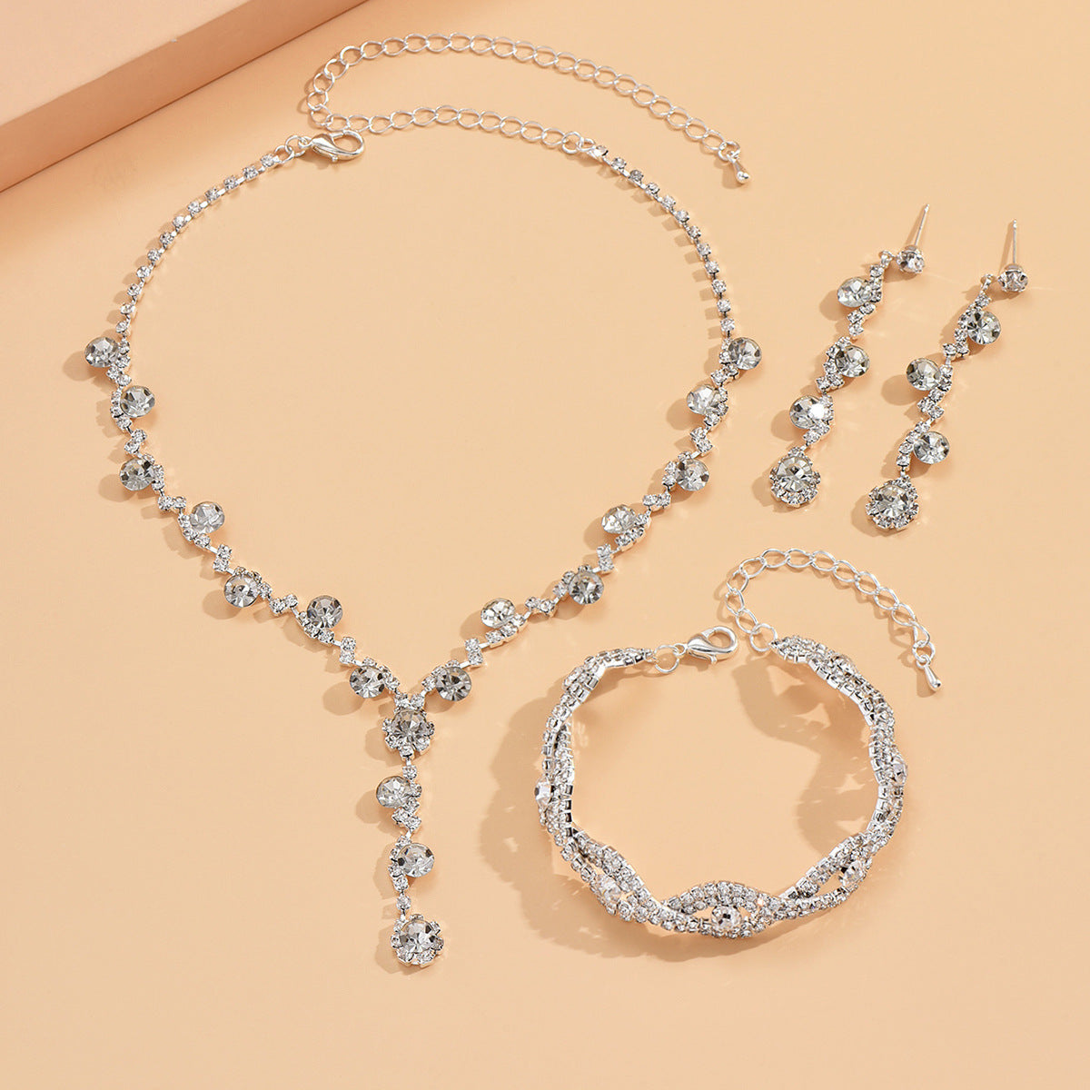 Set de Collar Aretes y Pulsera Aurum - Plateado